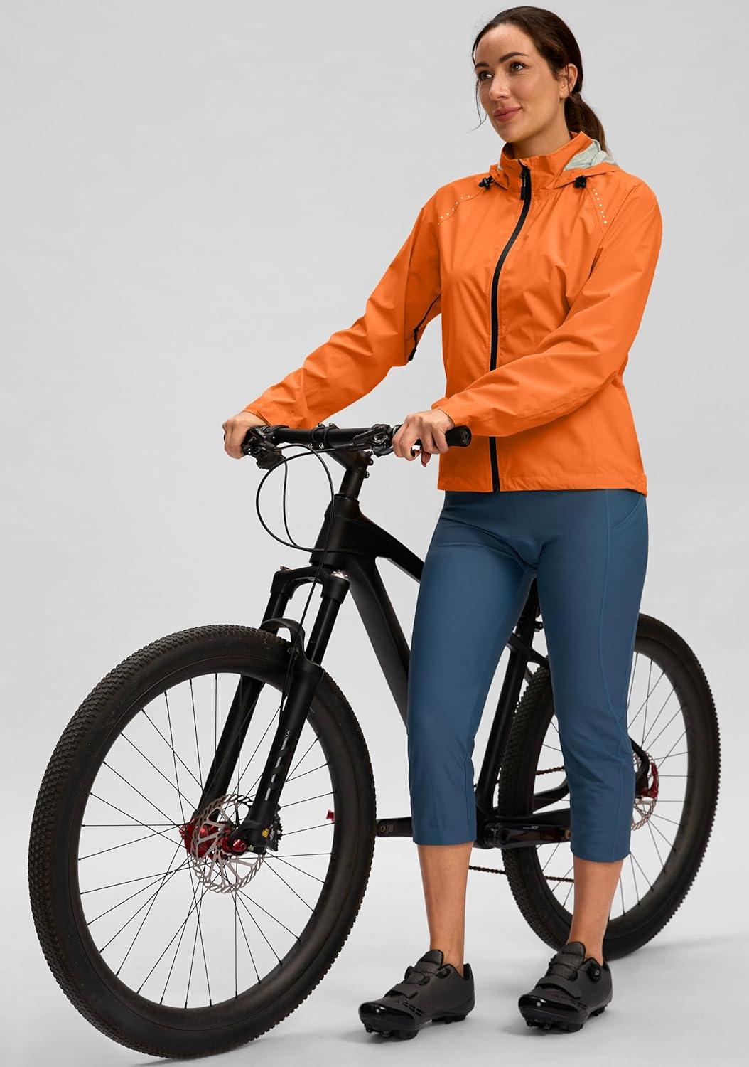 imageBikewa Womens Cycling Rain Jackets Waterproof Windbreaker Lightweight Running Windproof Reflective Jacket Packable HoodedOrange